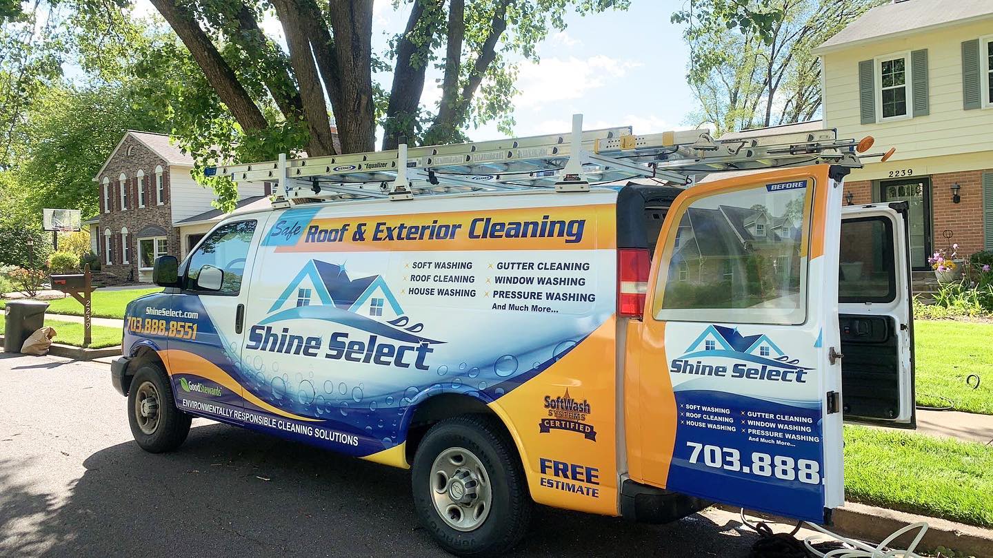 shine select work van parked outside of a home